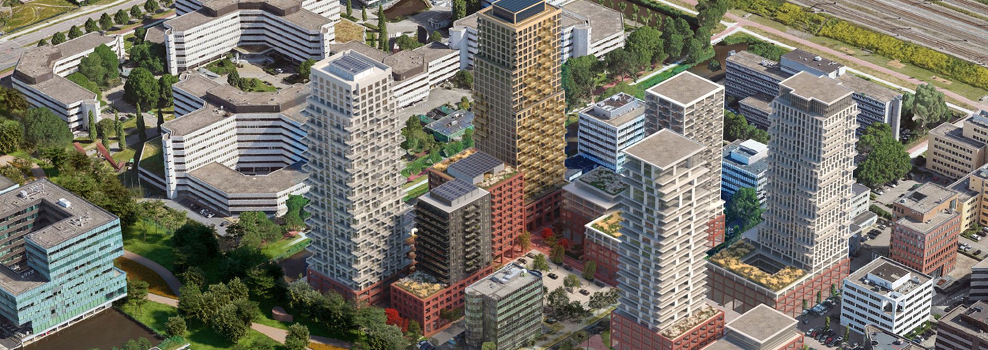 Een luchtfoto van Zuidoost Amstel. Er zijn verschillende hoge appartementengebouwen zichtbaar.
